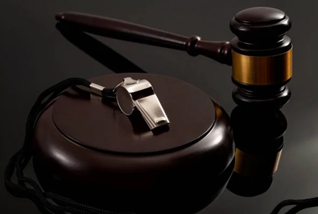 Photo of whistle and gavel.