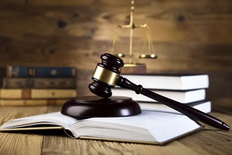 A legal book with a gavel