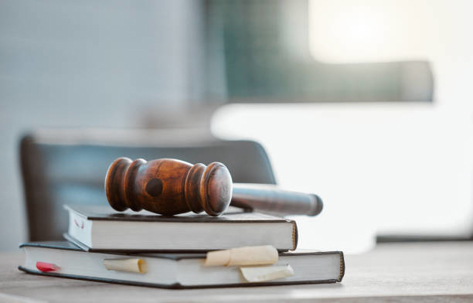 A stack of books with a gavel