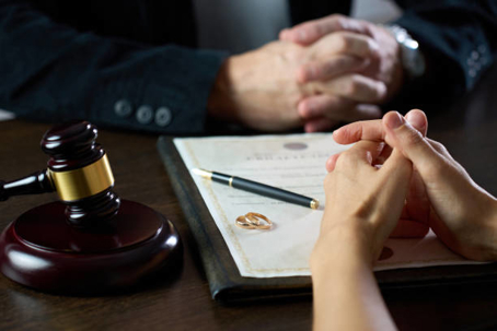 Hands over a contract