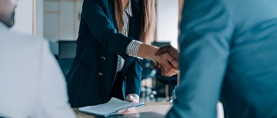 Meeting and handshake with two people